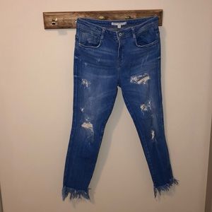 Distressed denim skinny jeans